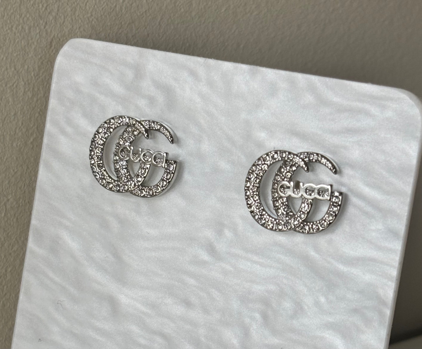 Boucles d’oreille double g silver